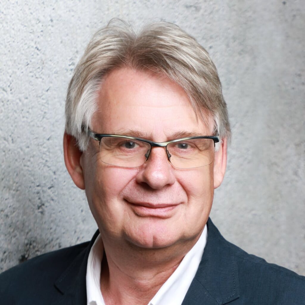 Das Bild zeigt ein Portrait von Hans-Georg Lampson.